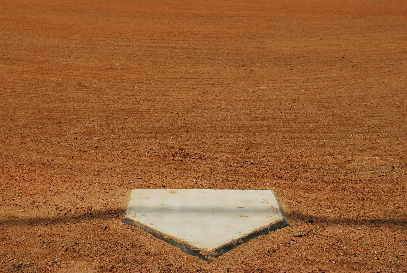 Why are Softball Infields Dirt and not Grass? 3 Main Reasons